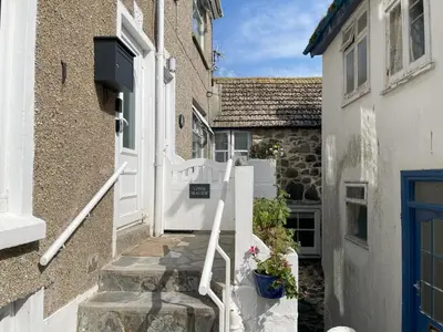 a stairway leading to a door of a house at Upper Seaview in St Ives
