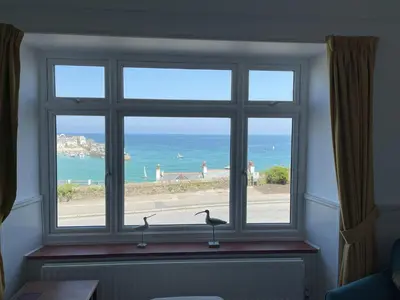 a window with a view of the beach at Morvah - stunning views of the harbour and beyond in St Ives