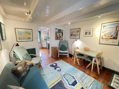 a living room with a couch and a table at The Green House in St Ives
