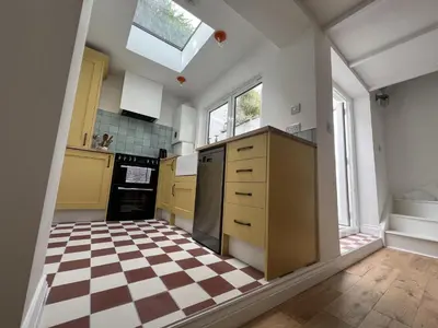a kitchen with a checkered floor at 9 Mount Pleasant in St Ives
