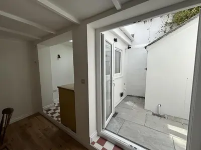 an empty room with a window and a door at 9 Mount Pleasant in St Ives