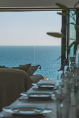 a table with a view of the ocean on a ship at Holiday home with incredible sea views in Mevagissey