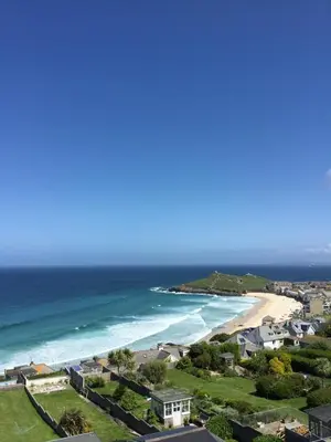 a view of a beach with houses and the ocean at Ten Ocean View in St Ives