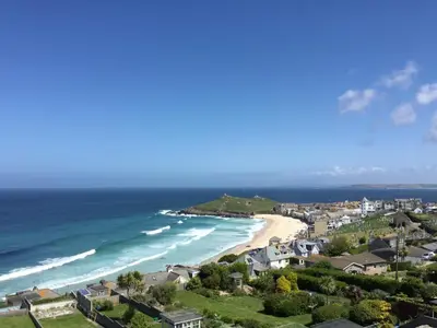 an aerial view of a beach with houses and the ocean at Ten Ocean View in St Ives