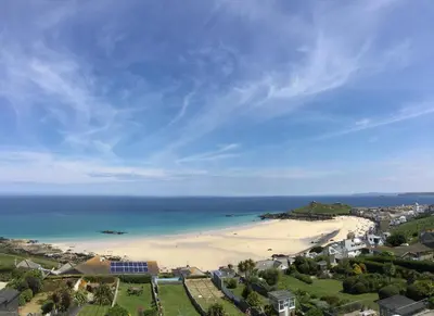 an aerial view of a beach with the ocean at Ten Ocean View in St Ives