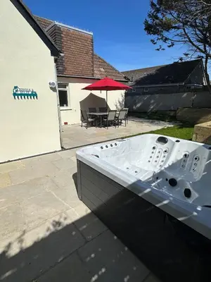 a boat sitting on the ground in a yard at Luxury, Tranquillity Near Beach in Carbis Bay
