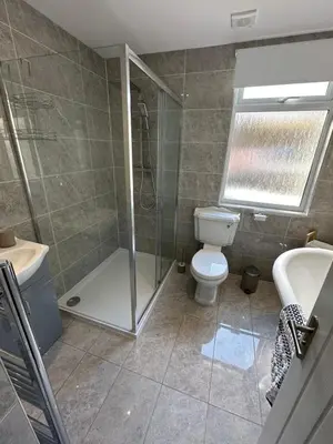 a bathroom with a shower and a toilet and a sink at Luxury, Tranquillity Near Beach in Carbis Bay