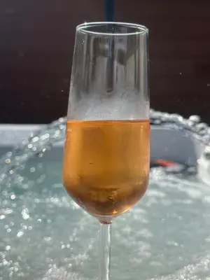 a glass of wine sitting in a tub of water at Luxury, Tranquillity Near Beach in Carbis Bay