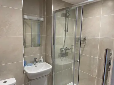 a bathroom with a shower and a sink at 36 Carrack Widden in St Ives