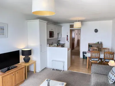 a living room with a kitchen and a living room at 36 Carrack Widden in St Ives