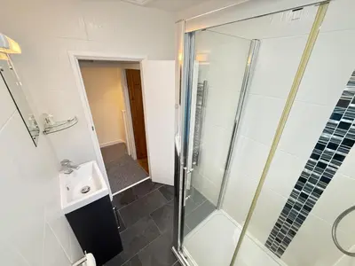 a bathroom with a shower and a sink at An Argh Vyghan - the little ark in St Ives