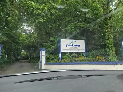 a view from a car window of a sign at 52 strawberry in Hayle