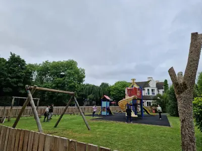 a group of people playing on a playground at 52 strawberry in Hayle