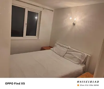 a small bedroom with a bed and a window at 52 strawberry in Hayle