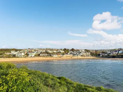 a view of a beach with a town in the background at Liwus in Newquay