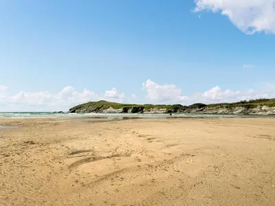 a heart drawn in the sand on a beach at Liwus in Newquay