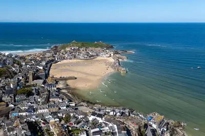 an aerial view of a beach and the ocean at Low Tide Bedford Rd Boutiques in St Ives