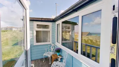 a tiny house with a view of the ocean at B18 Sandford, Riviere Towans in Hayle