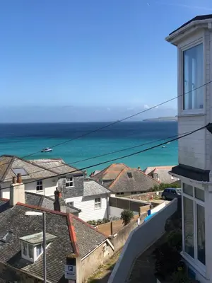 a view of the ocean from a house at Dixies View - 2 bed apartment - Central St Ives in St Ives