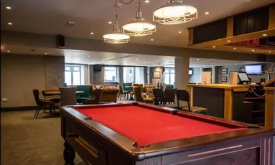 a pool table in a room with a bar at Sea Breeze Escape in Cubert