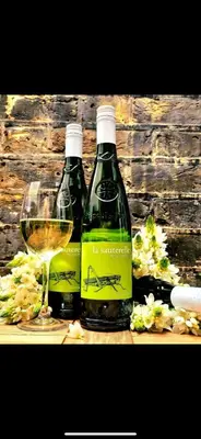 two bottles of wine and a glass of white wine at OXOX - Room Only Accommodation in Polperro