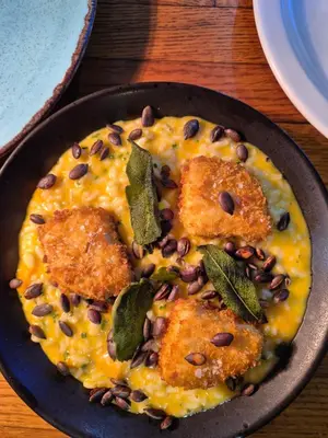 a plate of food with black beans andfried food at OXOX - Room Only Accommodation in Polperro