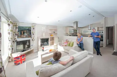 a group of people in a living room at St. Ives Holiday Village in St Ives