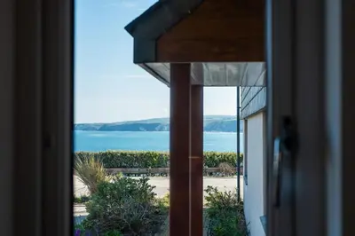 a view of the ocean from a house door at Seaspray in Port Isaac