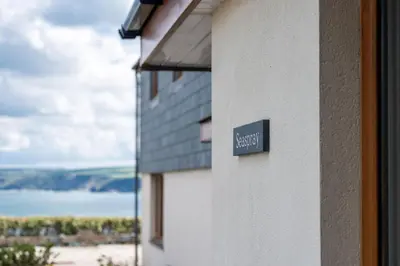 a sign on the side of a building at Seaspray in Port Isaac