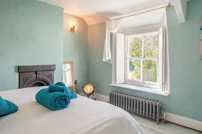 a bedroom with a bed with a blue towel on it at 3 Bed in St. Teath oc-r31945 in Saint Teath