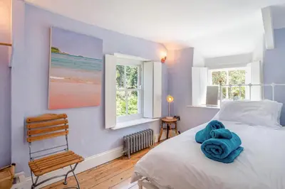 a bedroom with a bed with blue towels on it at 3 Bed in St. Teath oc-r31945 in Saint Teath