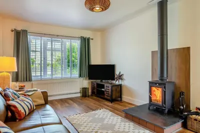 a living room with a couch and a wood stove at 1 Bed in Summercourt oc-b31829 in Saint Enoder