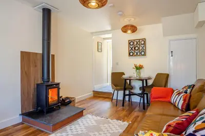 a living room with a wood stove in it at 1 Bed in Summercourt oc-b31829 in Saint Enoder