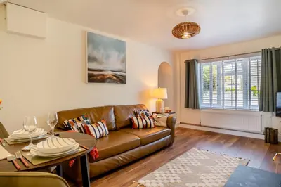 a living room with a couch and a table at 1 Bed in Summercourt oc-b31829 in Saint Enoder