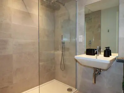 a bathroom with a sink and a shower at Ebbtide in Newquay