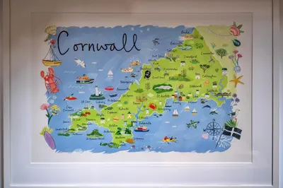 an illustrated map of ireland on a wall at Finest Retreats - The Old Store in Portloe