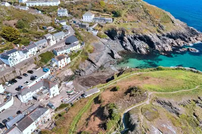 an aerial view of a village on a cliff at Finest Retreats - The Old Store in Portloe