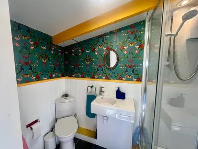 a small bathroom with a toilet and a sink at The Escape in Crackington Haven