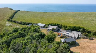 an aerial view of a house on a hill at The Escape in Crackington Haven