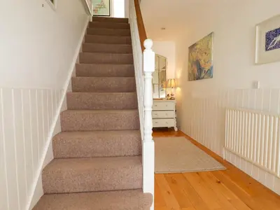 a stairway in a home with a carpet at Goatsland in Wadebridge