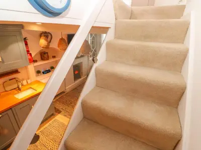 a staircase in a tiny house at Seahorse Cottage in St Ives