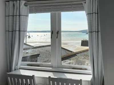 a window with a view of the beach at Seahorse Cottage in St Ives