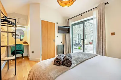 a bedroom with a bed with towels on it at 4 Bed in Penryn oc-c27969 in Penryn