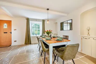 a kitchen and dining room with a table and chairs at 4 Bed in Penryn oc-c27969 in Penryn