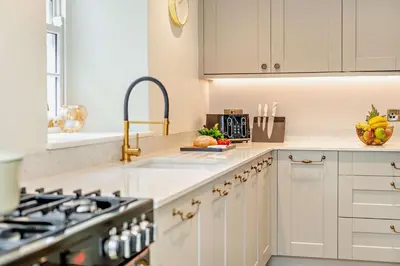 a kitchen with white cabinets and a sink at 3 Bed in Penryn oc-chy969 in Penryn