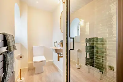 a bathroom with a shower with a toilet and a sink at 3 Bed in Penryn oc-chy969 in Penryn