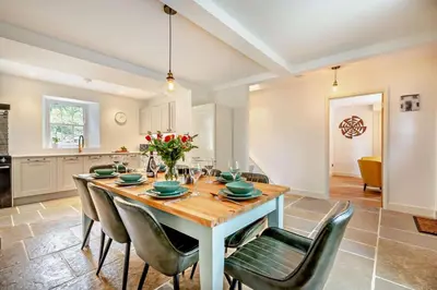 a kitchen and dining room with a table and chairs at 3 Bed in Penryn oc-chy969 in Penryn