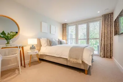 a bedroom with a bed and a large window at 2 Bed in Padstow oc-h32002 in Padstow