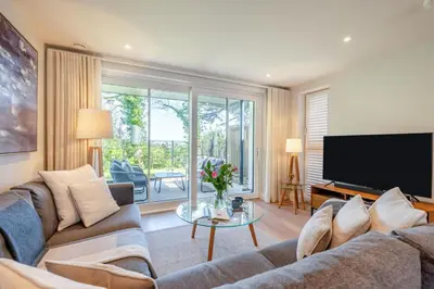 a living room with a couch and a tv at 2 Bed in Padstow oc-h32002 in Padstow