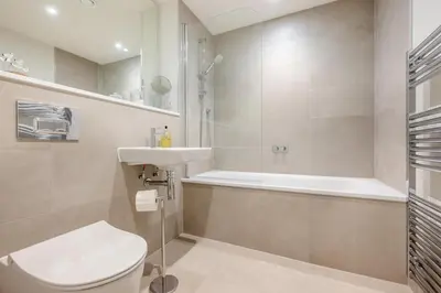 a bathroom with a toilet and a sink and a tub at 2 Bed in Padstow oc-h32002 in Padstow